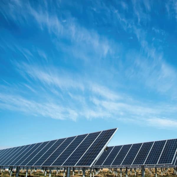 Blue sky background with solar panels in foreground